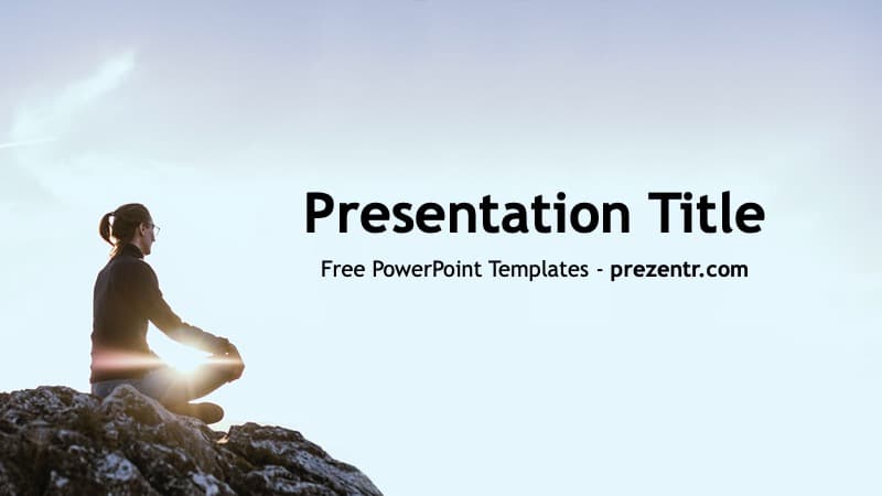 Woman meditating on rocky cliff at sunset with light glow, blue sky background for Meditation PowerPoint Template cover slide